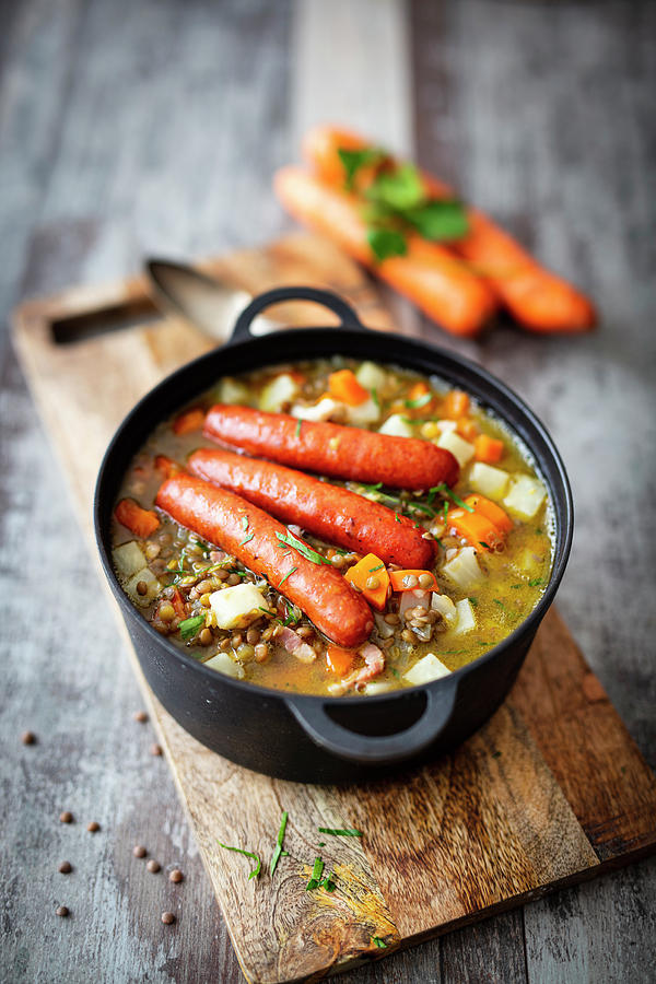 Lentil Stew With Bacon And Cooked Sausages Photograph by Jan Wischnewski