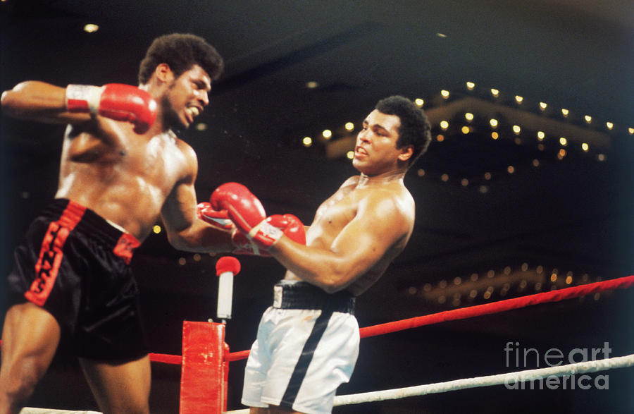 Leon Spinks And Muhammad Ali During Bout Photograph by Bettmann
