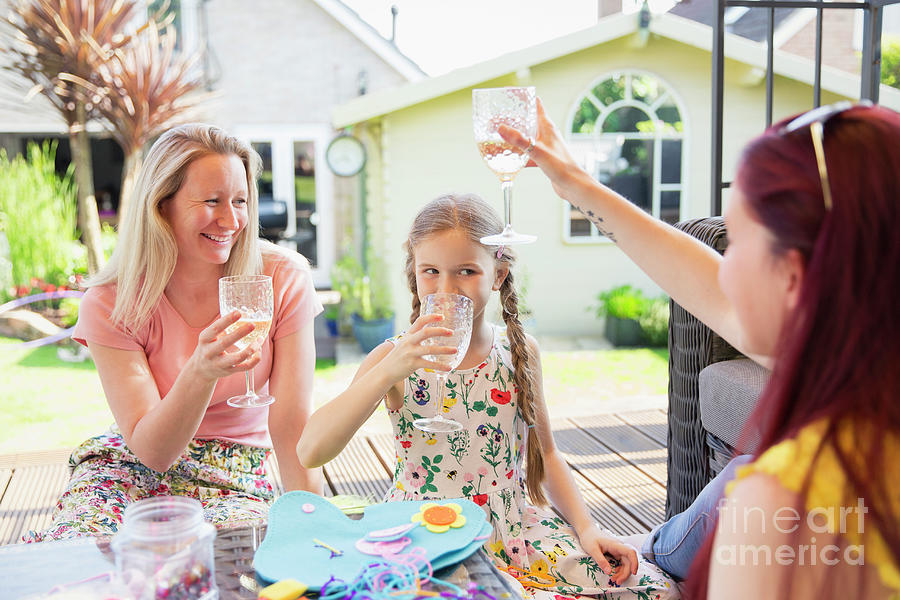 Lesbian Couple And Daughter Drinking Photograph By Caia Imagescience 