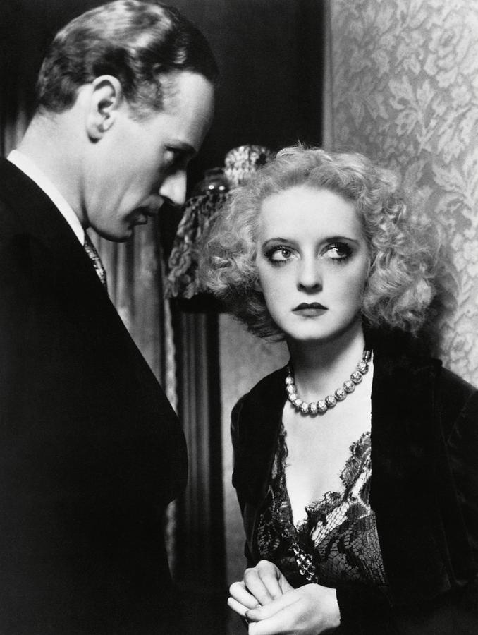 LESLIE HOWARD and BETTE DAVIS in OF HUMAN BONDAGE -1934-. Photograph by Album