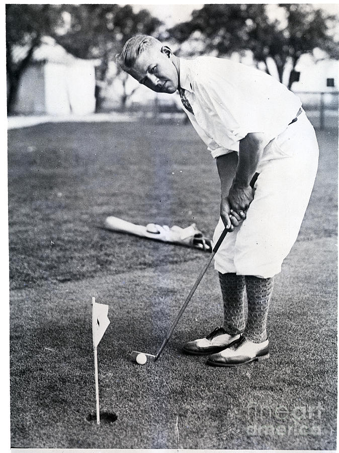 Lester Bolstad Plays Golf Near Hole Photograph by Bettmann