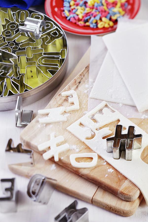 Letters Cut Out Of Puff Pastry And Alphabet Pastry Cutters Photograph by Franziska Taube