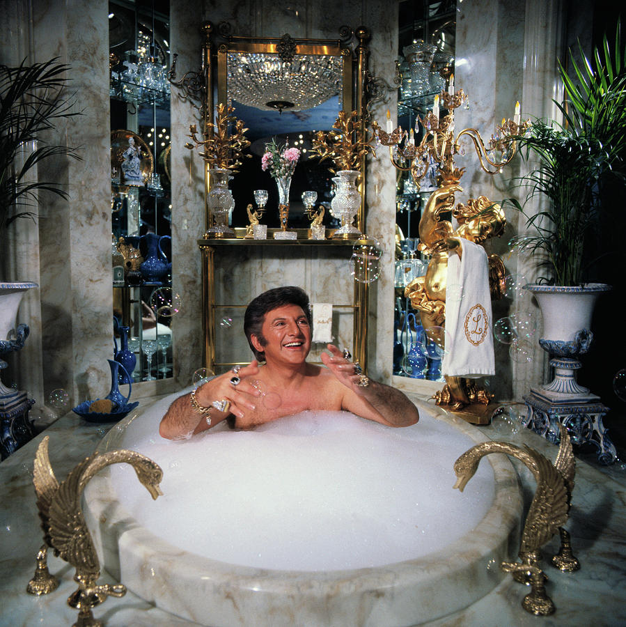 Liberace Taking A Bubble Bath Photograph by Bettmann
