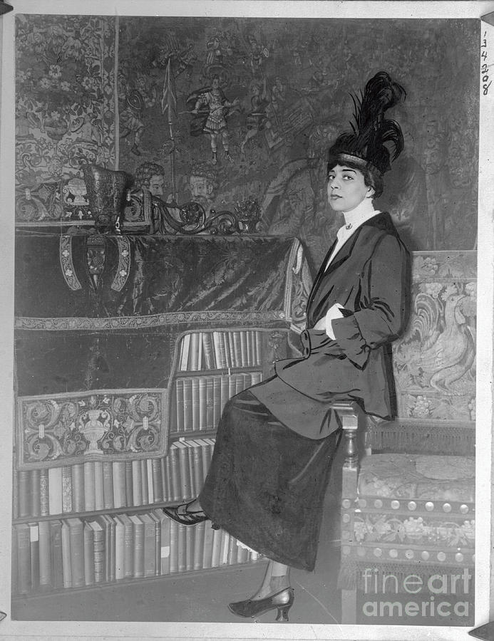 Librarian Sitting Near Book Collection Photograph by Bettmann