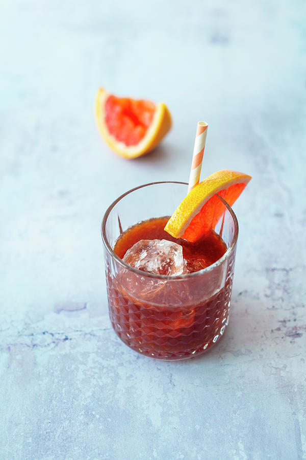 Licorize It mocktail With Licorice Syrup, Grenadine And Pink Grapefruit Juice Photograph by Jan Wischnewski