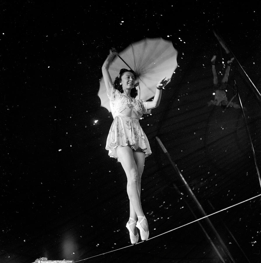 Umbrella Photograph - Life Visits the Circus in Florida- Acrobats practicing by Nina Leen
