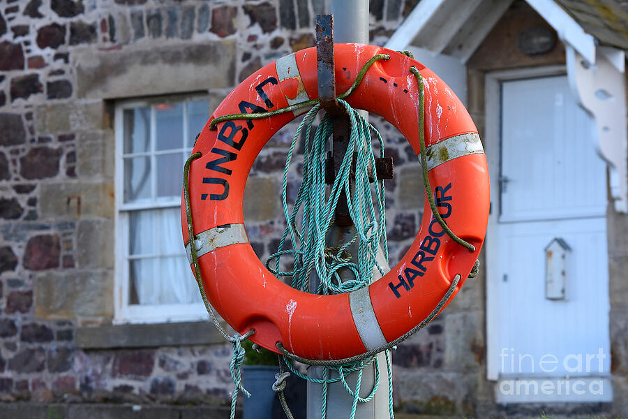 Lifebuoy and Rope Photograph by Yvonne Johnstone