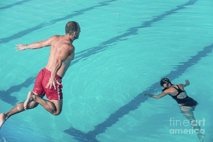 Lifeguard Jumping To The Rescue Photograph By Microgen Imagesscience