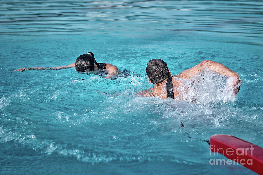 Lifeguard Swimming Towards Drowning Woman Photograph By Microgen Images