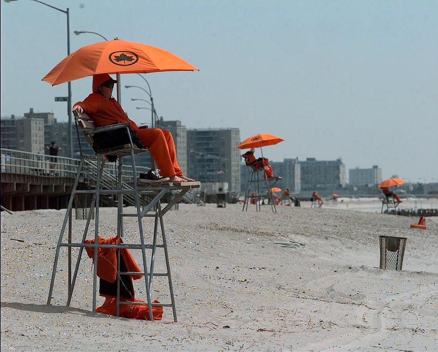 Lifeguards Survey The Ocean At Rockaway Photograph by New York Daily News Archive