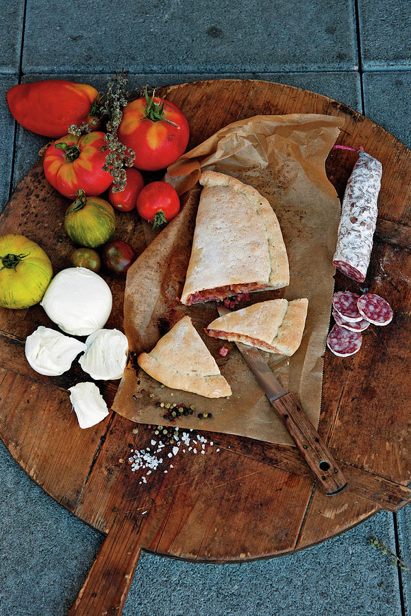 Light Calzone With Salami, Tomatoes And Mozzarella Photograph by Tre Torri