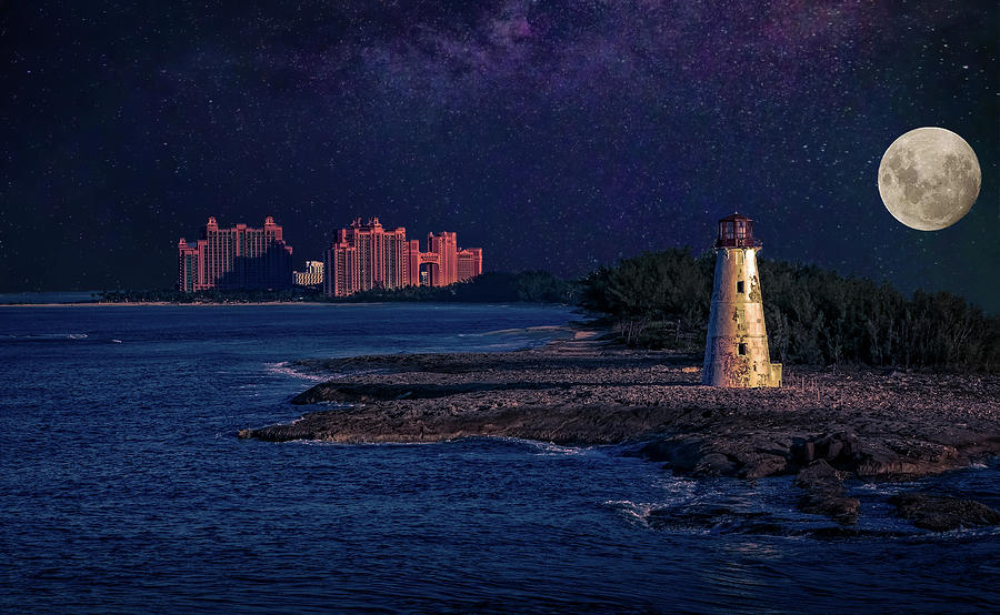 Lighthouse and Resort in Bahamas at Night Photograph by Darryl Brooks
