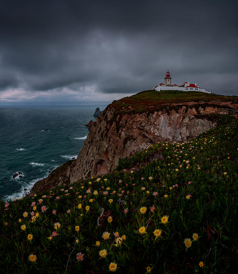 Lighthouse On Cliff Photograph by Jimmy Yang