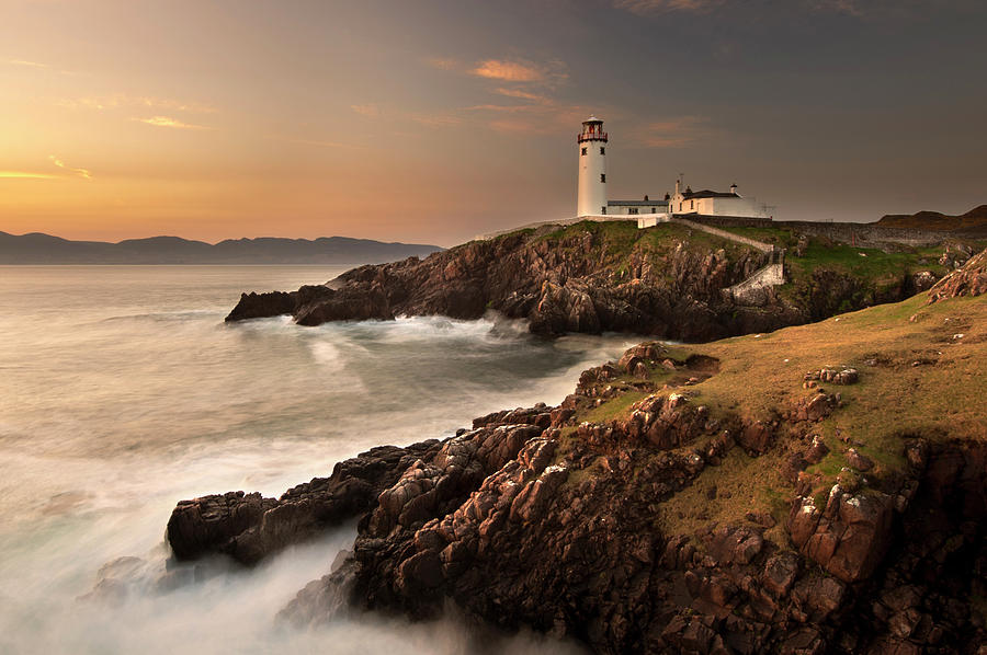 Lighthouse On Foggy Coastline Photograph by George Karbus Photography