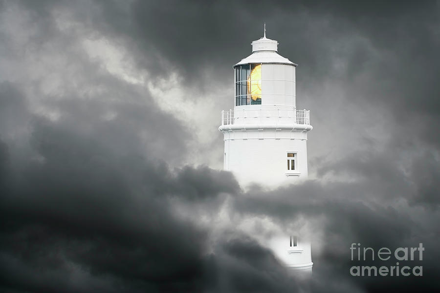 Lighthouse Surrounded By Clouds Photograph by Conceptual Images/science Photo Library