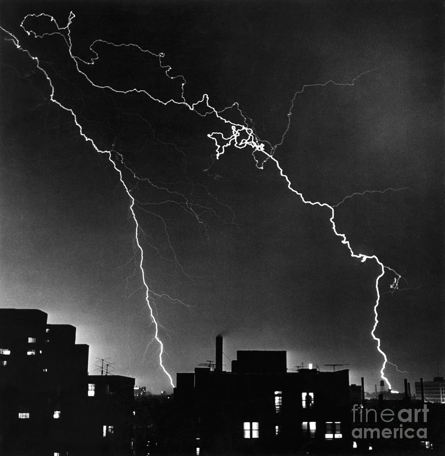Lightning Striking Over City Buildings Photograph by Bettmann