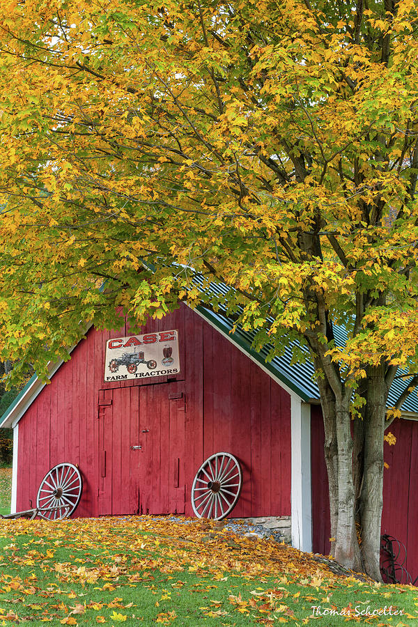Cute Red Vermont Barn and Wagon Wheels Photograph by Photos By Thom