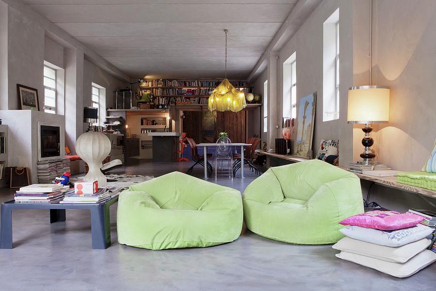 Lime Green Beanbag Armchair And Collection Of Different Lamps In Large, Open-plan Loft Apartment Photograph by Fabio Lombrici
