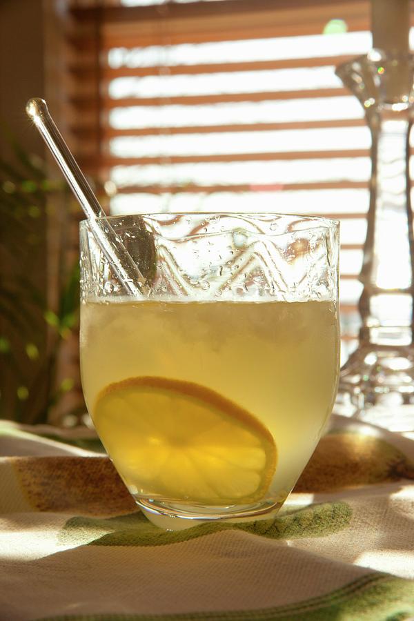 Limoncello Cocktail With A Slice Of Lemon Photograph by William Boch