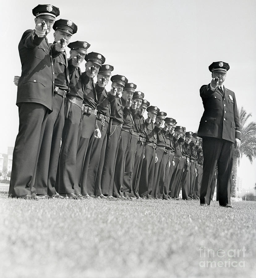 Line Of Policemen Taking Aim Photograph by Bettmann