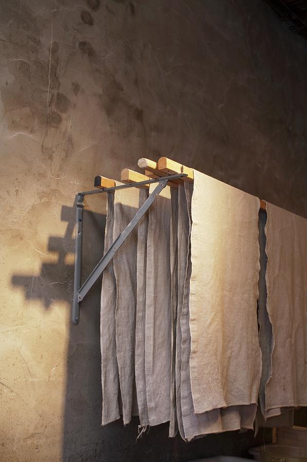 Linen Cloths On Wall-mounted Clothes Airer Photograph by Jennifer Martine