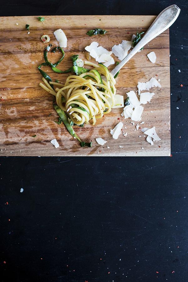 Linguine With Courgettes, Spinach And Parmesan Cheese On A Fork seen From Above Photograph by Carolina Auer Photography