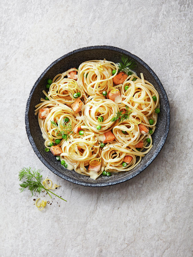 Linguine With Salmon, Peas, Dill, Lemon Zest And A Creamy Sauce Photograph by Thorsten Kleine Holthaus
