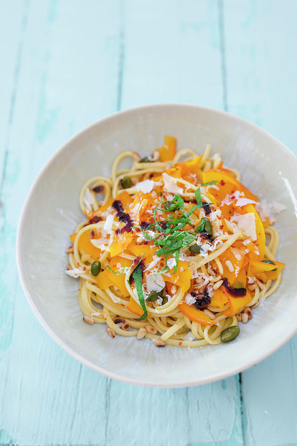 Linguini With Pumpkin, Pistachio Nuts, Pine Nuts And Pecorino Cheese Photograph by Jan Wischnewski