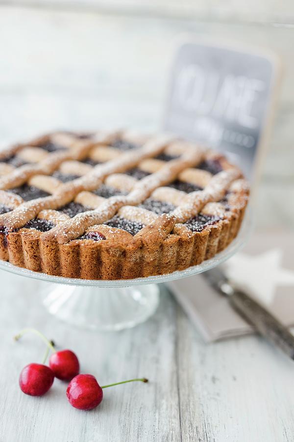 Linzer Cake Dusted With Icing Sugar Photograph by Jan Wischnewski