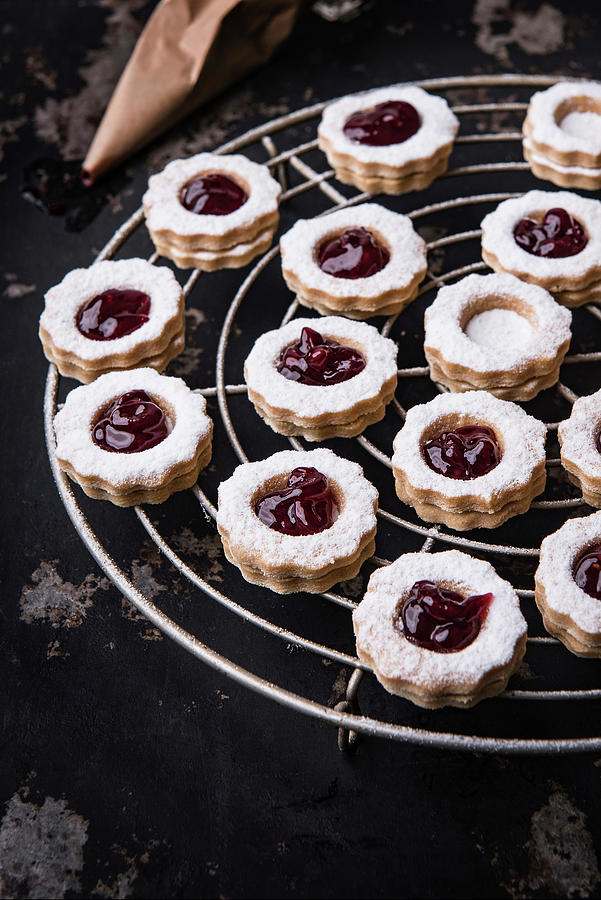 Linzer Cookies With Currant Jelly On A Cooling Rack Photograph by Sylvia Meyborg