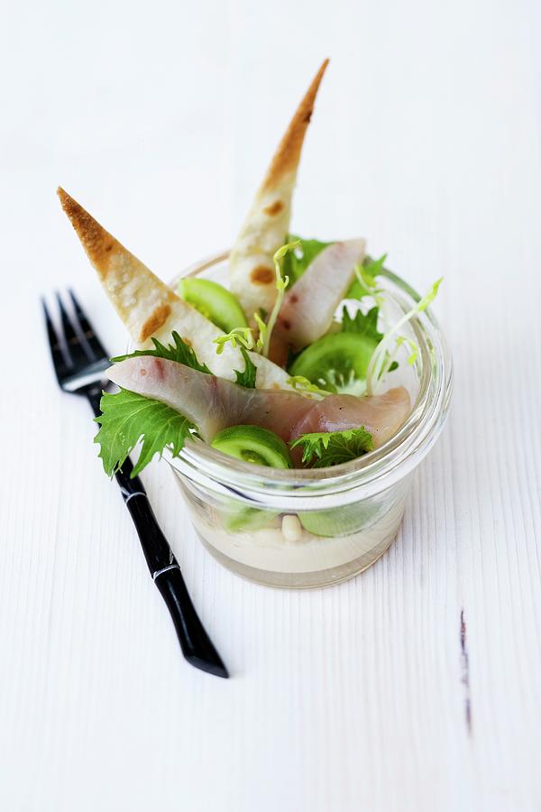 Liquorice Smoked Swordfish With Hummus, Green Tomatoes And Crispy Unleavened Bread In A Glass Photograph by Michael Wissing