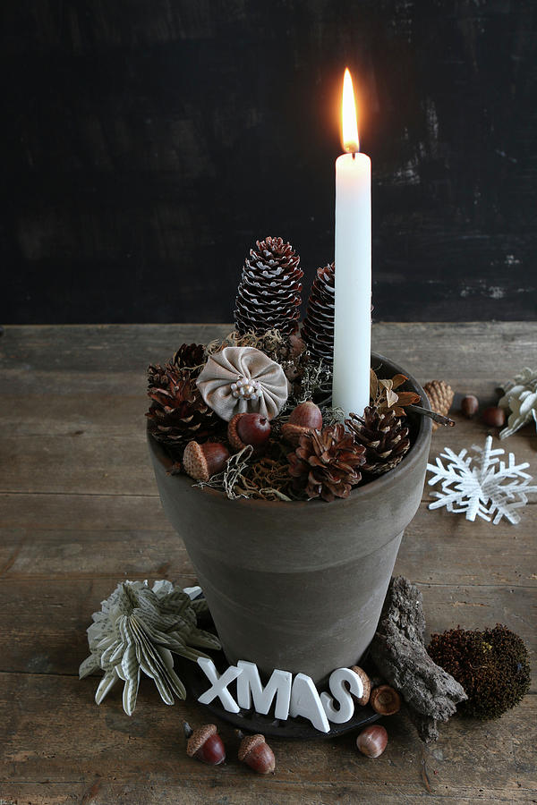 Lit Candle In Clay Pot With Festive Decorations Photograph by Regina Hippel