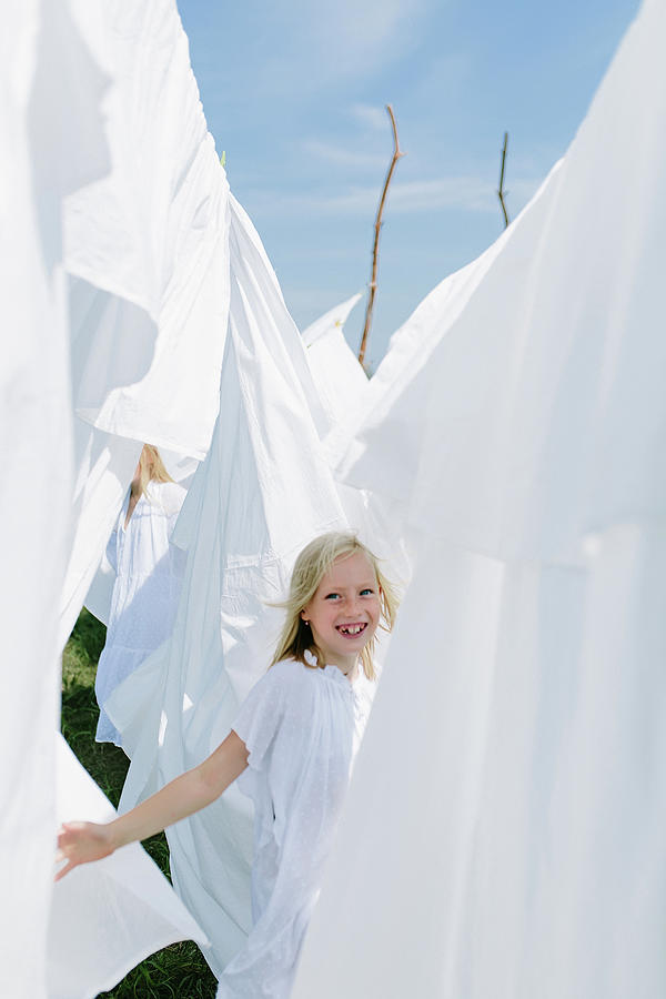 Summer Photograph - Little Blondes In Summer Play With Sheets by Cavan Images