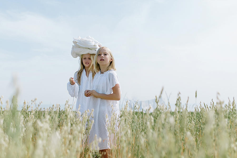Summer Photograph - Little Blondes In The Village Carry The Washed Laundry by Cavan Images