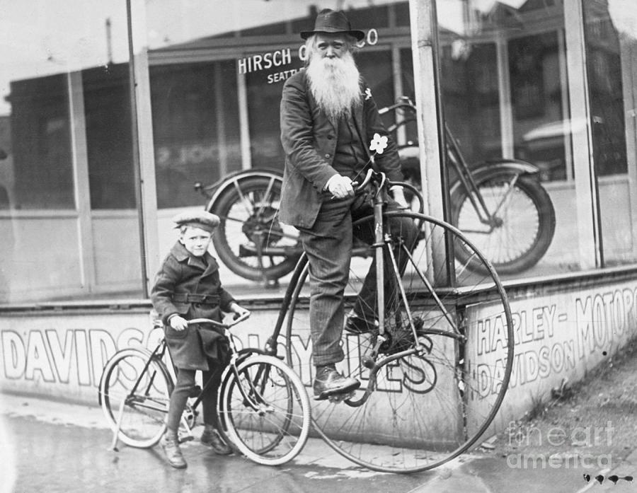 Little Boy And Grandfather On Bicycles Photograph by Bettmann