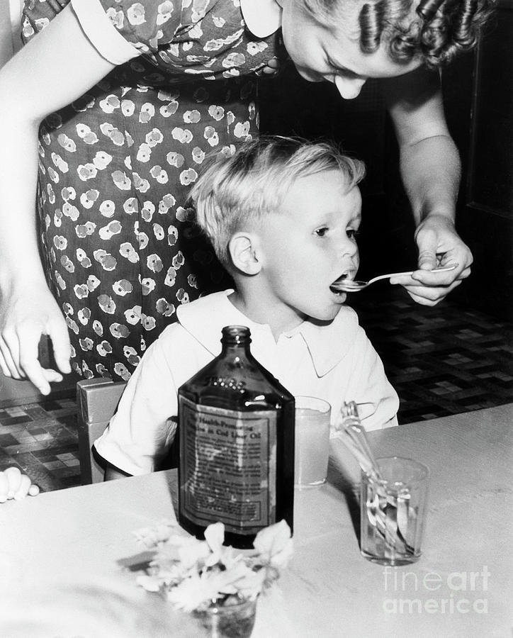 Little Boy Getting Dose Of Cod Liver Oil Photograph by Bettmann
