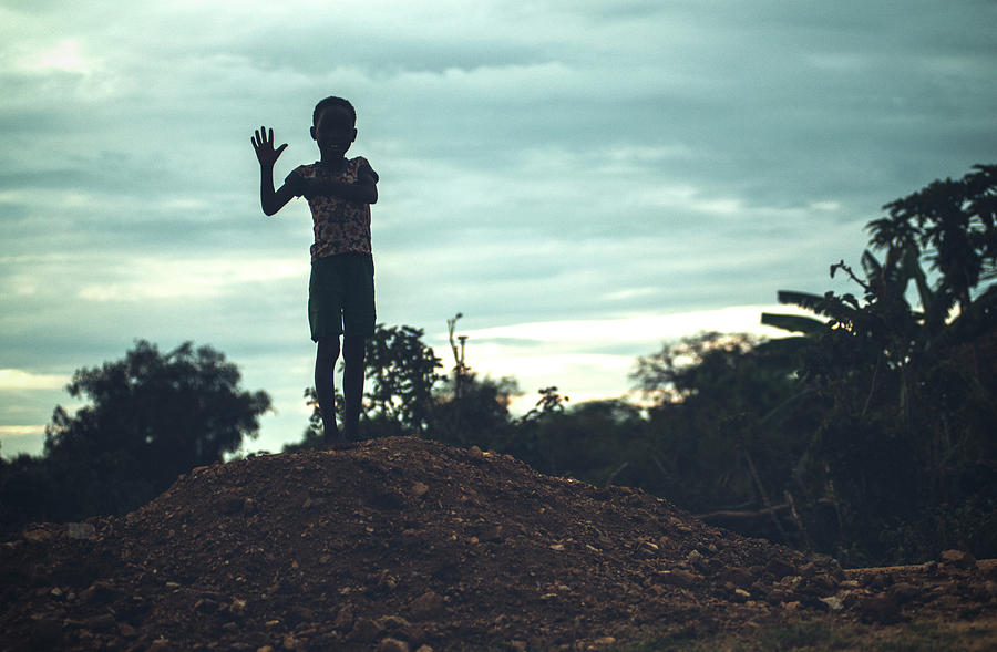 Little ethnic boy in dusky countryside Photograph by Eduardo Huelin ...