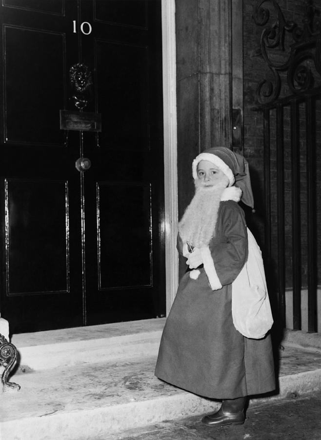 Little Girl Dresses Up In Santa Claus Photograph by Keystone-france