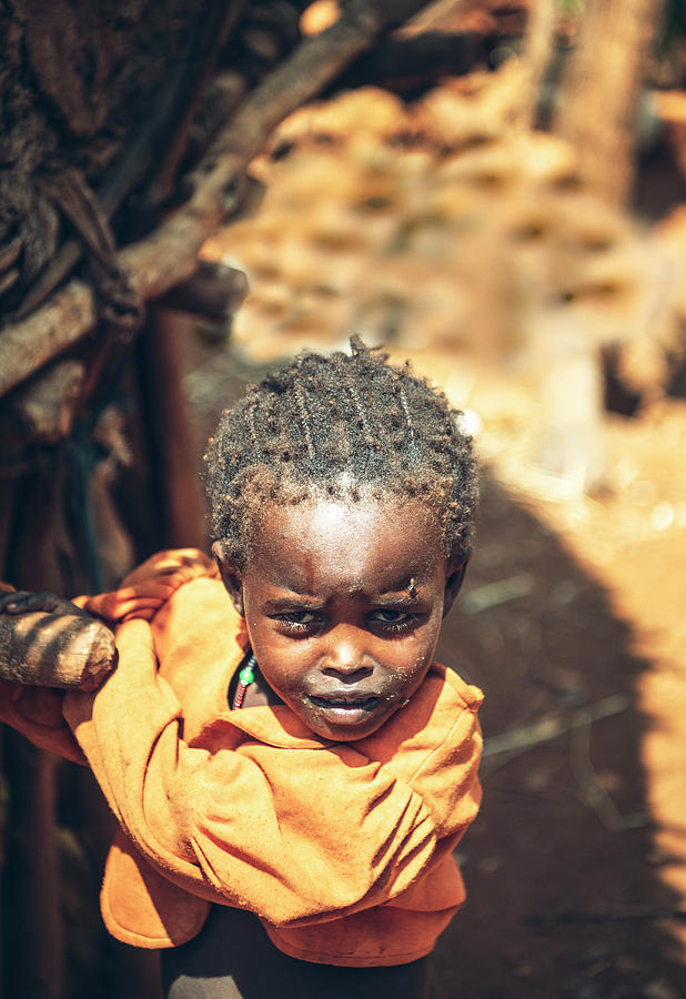 Little girl of Konso tribe on terrace with rocks and trees, Omo Valley ...