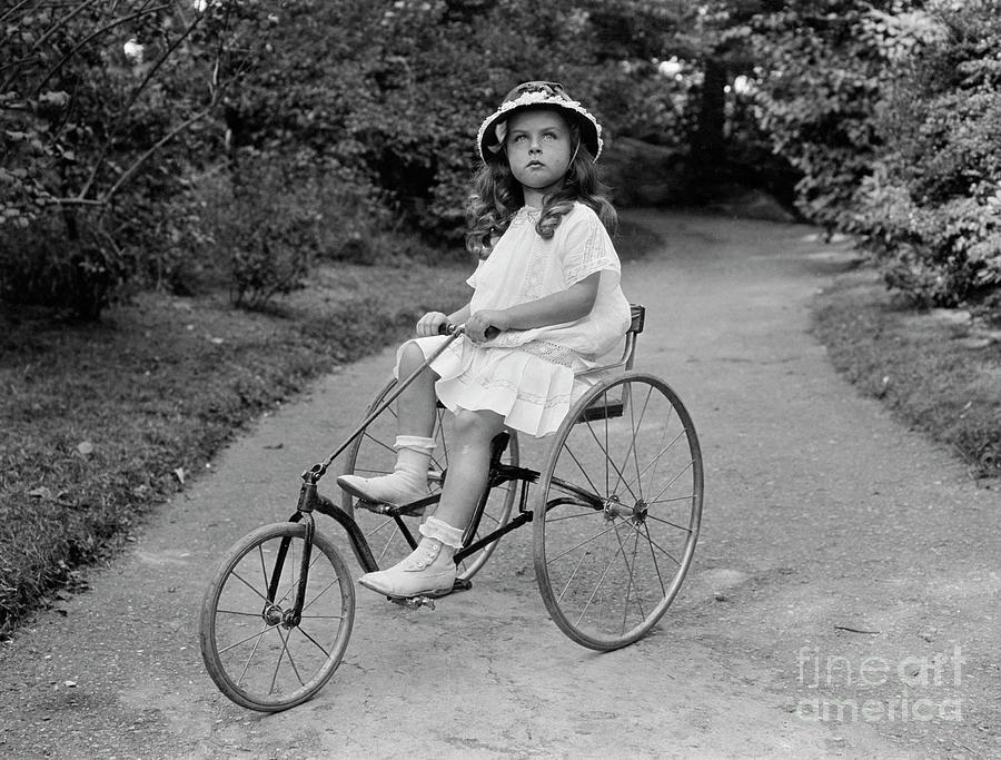 Little Girl Riding Tricycle by Bettmann