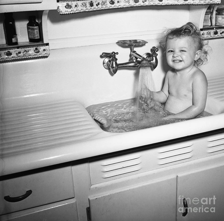 Little Girl Taking Bath In Kichen Sink Photograph by Bettmann