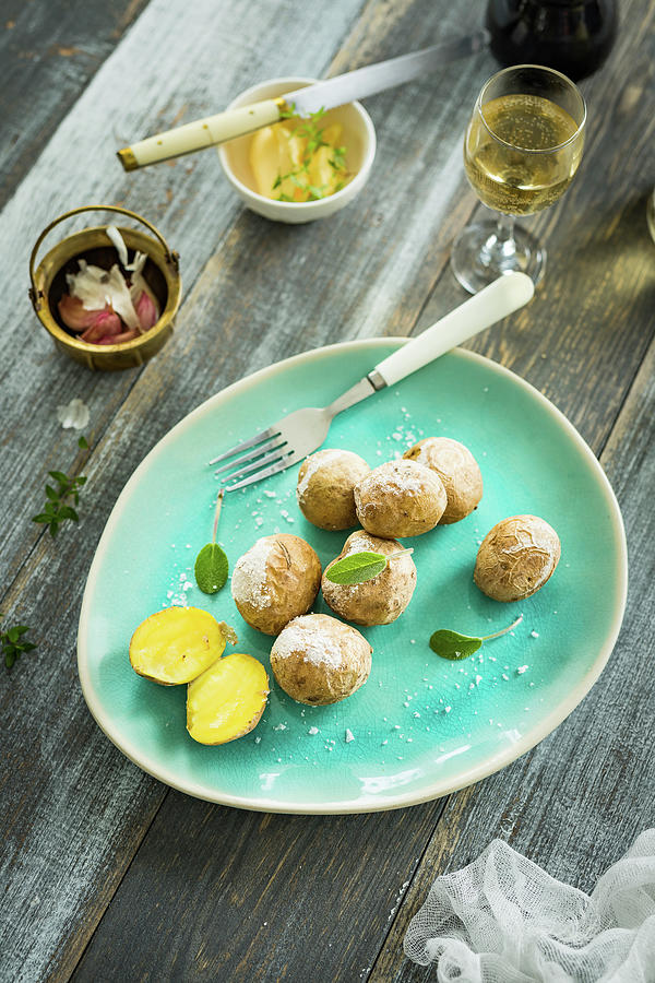 Little Potatoe Baked In Salt With Fresh Herbs Photograph by Osmykolorteczy