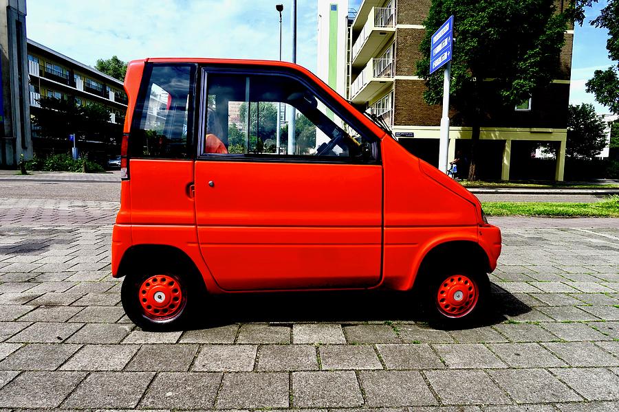 Little Red Car of Amsterdam Photograph by Chris Bavelles