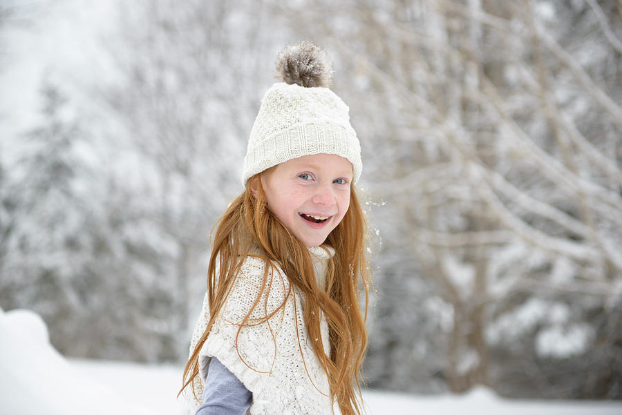 Little Red Haired Girl Playing In The Snow Photograph by Cavan Images ...