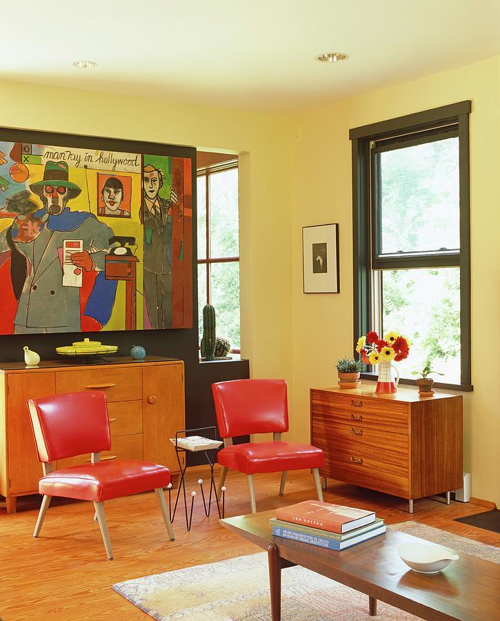 Living Room With Red Chairs And Colorful Painting Photograph by Evan Sklar