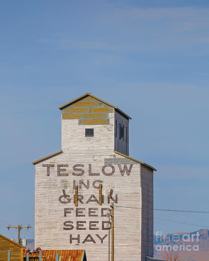 Livingston Montana historic Teslow grain elevator at sunset Photograph by Edward Fielding