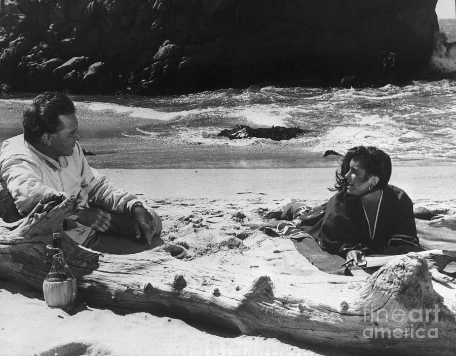 Liz Taylor And Richard Burton On Beach Photograph by Bettmann