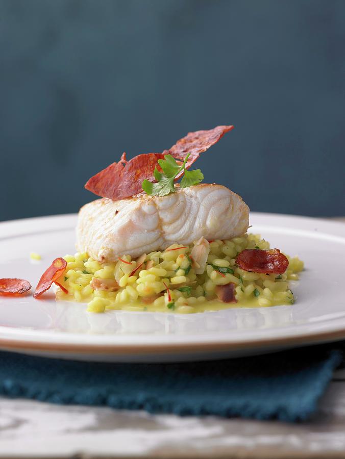 Loach Fillet With Almond And Saffron Risotto And Chorizo Photograph by Jalag / Jan-peter Westermann