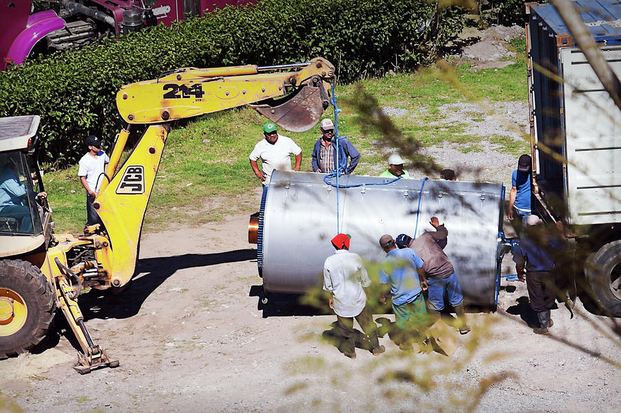 Loading a coffee roasting bin at Finca Lerida, Panama by Tatiana Travelways Loading a coffee roasting bin at Finca Lerida, Panama by Tatiana Travelways