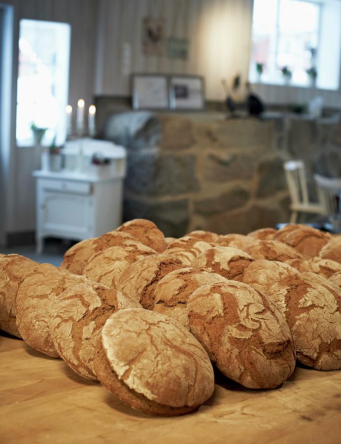 Loaves Of Bread In A Bakery Photograph by Hannah Kompanik